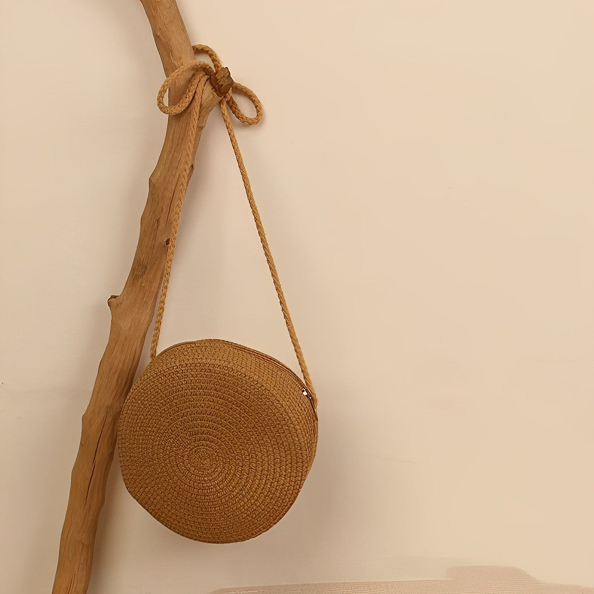 Round straw bag with zip closure and rope shoulder strap