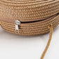 Round straw bag with zip closure and rope shoulder strap