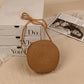 Round straw bag with zip closure and rope shoulder strap