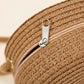 Round straw bag with zip closure and rope shoulder strap