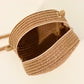Round straw bag with zip closure and rope shoulder strap