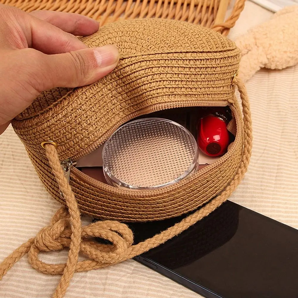 Round straw bag with zip closure and rope shoulder strap