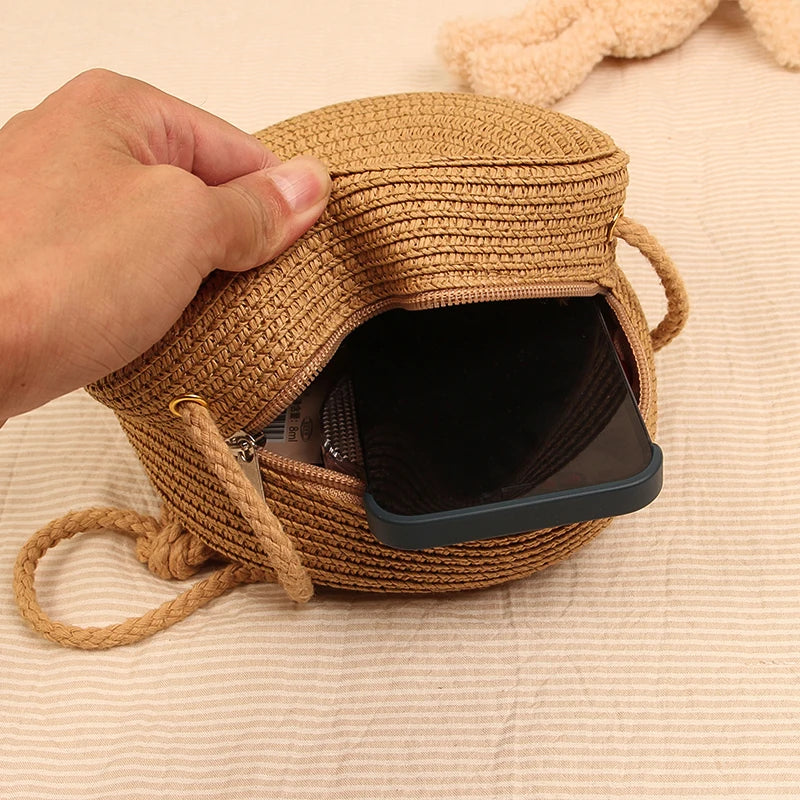 Round straw bag with zip closure and rope shoulder strap