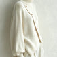 Diagonal Button Roll Neck