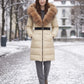 Long Belted Puffer Jacket with Large Faux Fur Hood