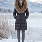 Long Belted Puffer Jacket with Large Faux Fur Hood