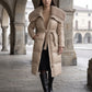 Long Belted Puffer Jacket with Faux Fur Collar
